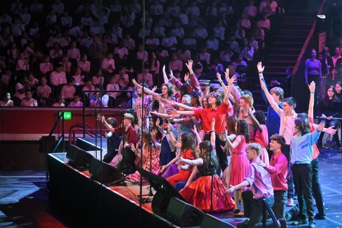 Young performers on stage at the Royal Albert Hall showcase scenes from West Side Story