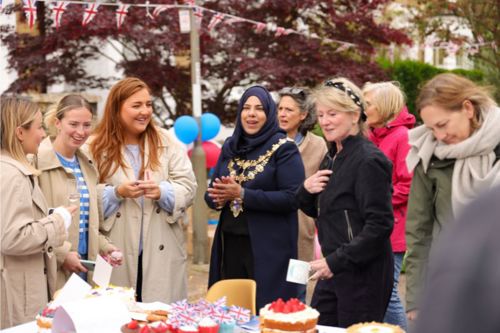 A group of women chatting with the Mayor of Wandsworth at a street party on Geraldine Road, SW18.