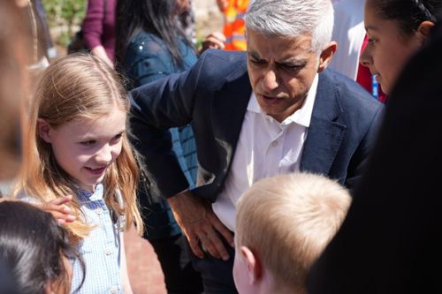 Mayor of London Sir Sadiq Khan talking to two young people