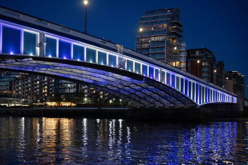 Wandsworth Bridge lit up blue at night