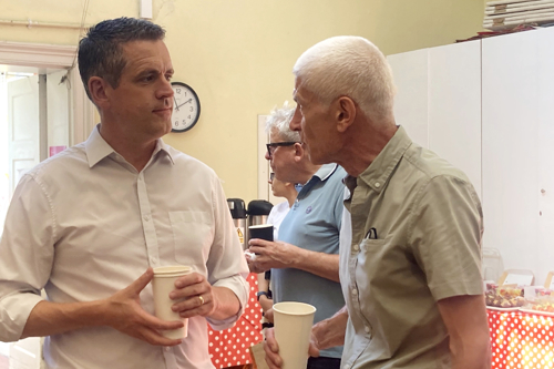 Council leader Simon Hogg listening to residents